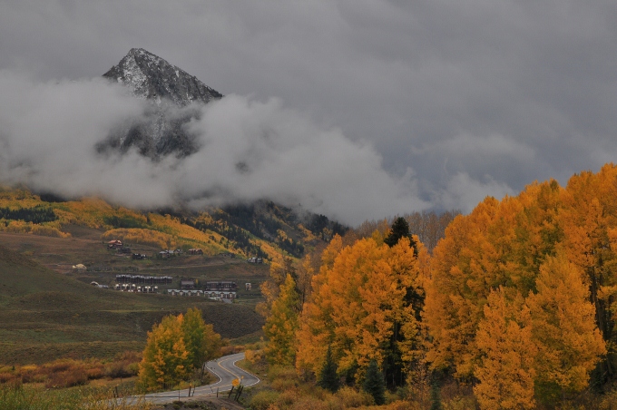 the fall-colored mountains of Crested Butte after a light snow